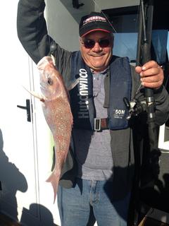 Gentleman posing with a snapper