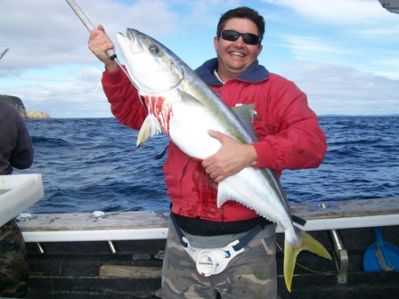 A nice kingfish being displayed by the skipper that was caught in the Hauraki Gulf
